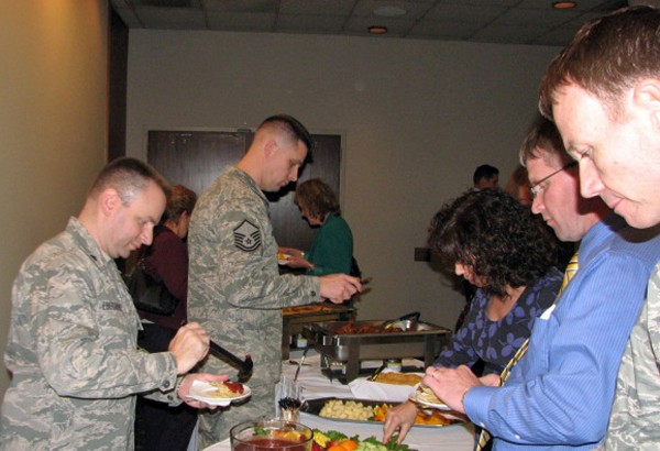 Participants partake in the appetizers at the chapter�s holiday mixer held at the Offutt Air Force Base Patriot Club in December. Several electronic giveaways were distributed during the event, including water bottles adorned with the chapter logo.